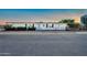 Home featuring desert landscaping, mature plants and a covered carport at 3433 E Sandra Ter, Phoenix, AZ 85032
