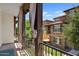 Outdoor balcony with wrought iron railing, wood columns, and outdoor drapes, offering scenic neighborhood views at 3623 E Horace Dr, Gilbert, AZ 85296