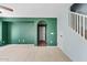 Open hallway with carpet and an arched entryway, offering a bright and airy feel at 3623 E Horace Dr, Gilbert, AZ 85296