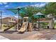 A community playground includes slides, a shade structure and other playground equipment at 3623 E Horace Dr, Gilbert, AZ 85296