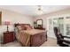 Comfortable bedroom with a full-size bed, a cozy atmosphere, and plenty of natural light at 3701 E Morrow Dr, Phoenix, AZ 85050