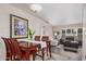 Open dining area featuring a wooden table set and view of the living room at 3701 E Morrow Dr, Phoenix, AZ 85050