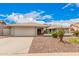 Charming single-story home with a well-manicured front yard and a two-car garage at 3701 E Morrow Dr, Phoenix, AZ 85050