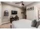 Bedroom with King bed featuring a neutral wall color, carpet flooring and study desk at 37301 N 99Th St, Scottsdale, AZ 85262