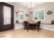Cozy breakfast nook with a built-in bench seating, natural light, and modern chandelier at 37301 N 99Th St, Scottsdale, AZ 85262