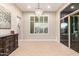 Elegant dining area with a chandelier, large window, and sliding door with access to the backyard at 37301 N 99Th St, Scottsdale, AZ 85262