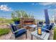 The outdoor fireplace is perfect for entertaining guests and relaxing with Gathering at 37301 N 99Th St, Scottsdale, AZ 85262
