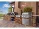 The outdoor kitchen with high end appliances is great for entertaining at 37301 N 99Th St, Scottsdale, AZ 85262