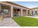 This large covered patio includes an outdoor dining area and a lounge space at 37301 N 99Th St, Scottsdale, AZ 85262