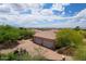Expansive aerial view of a desert home with a large garage and stunning mountain views at 39241 N Boulder View Dr, Scottsdale, AZ 85262