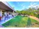 An expansive backyard featuring a lush lawn with a covered patio perfect for outdoor enjoyment at 39241 N Boulder View Dr, Scottsdale, AZ 85262