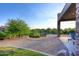 Gravel landscape surrounds the covered patio of this home in a desert community at 39241 N Boulder View Dr, Scottsdale, AZ 85262
