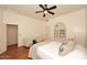 Calm bedroom featuring neutral tones, hardwood floors, and natural light from a window at 39241 N Boulder View Dr, Scottsdale, AZ 85262