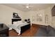 Bedroom boasts a bay window with a bench, hardwood floors, and a cozy seating area with a sofa at 39241 N Boulder View Dr, Scottsdale, AZ 85262