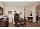 Traditional dining room with hardwood floors and dark wood furniture near an arched doorway at 39241 N Boulder View Dr, Scottsdale, AZ 85262