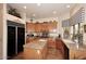 Bright kitchen with wooden cabinetry, granite countertops, and a kitchen island at 39241 N Boulder View Dr, Scottsdale, AZ 85262