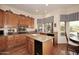 Classic kitchen featuring a center island, granite countertops, and wooden cabinets at 39241 N Boulder View Dr, Scottsdale, AZ 85262
