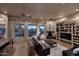 Spacious living room with hardwood floors, a fireplace, built-in shelving and entertainment center at 39241 N Boulder View Dr, Scottsdale, AZ 85262