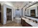 Elegant main bathroom with a large soaking tub, dual vanities, and a separate glass-enclosed shower at 39241 N Boulder View Dr, Scottsdale, AZ 85262