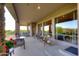 Covered patio ideal for outdoor living, with comfortable seating and serene desert views at 39241 N Boulder View Dr, Scottsdale, AZ 85262