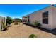 Well-maintained backyard featuring gravel landscaping and privacy fencing at 4080 W Goldmine Mountain Dr, San Tan Valley, AZ 85144