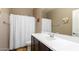 Bathroom with vanity, toilet, shower with curtain and fixtures at 4080 W Goldmine Mountain Dr, San Tan Valley, AZ 85144