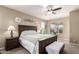 Comfortable bedroom featuring carpet, ceiling fan, a bed, and furniture at 4080 W Goldmine Mountain Dr, San Tan Valley, AZ 85144