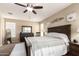Comfortable bedroom with carpet, ceiling fan, bed and furniture at 4080 W Goldmine Mountain Dr, San Tan Valley, AZ 85144