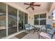 Relaxing covered patio featuring neutral colors, a ceiling fan, and comfortable seating area at 4080 W Goldmine Mountain Dr, San Tan Valley, AZ 85144
