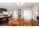 Cozy dining area featuring a wood table, dark wood floors, and neutral wall paint at 4080 W Goldmine Mountain Dr, San Tan Valley, AZ 85144