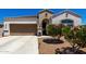Charming single-story home with a well-maintained yard and covered entryway, plus a two car garage at 4080 W Goldmine Mountain Dr, San Tan Valley, AZ 85144