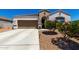 Charming single-story home with a well-maintained yard and covered entryway, plus a two car garage at 4080 W Goldmine Mountain Dr, San Tan Valley, AZ 85144