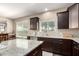 Spacious kitchen with granite countertops and wooden cabinets at 4080 W Goldmine Mountain Dr, San Tan Valley, AZ 85144