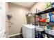 Laundry room with washer, dryer and storage racks at 4080 W Goldmine Mountain Dr, San Tan Valley, AZ 85144