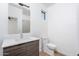 Contemporary bathroom with a single sink vanity, bright lighting, and tiled floor at 4220 N 32Nd St # 31, Phoenix, AZ 85018