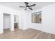 Spacious bedroom with sleek, minimalist design, ceiling fan, and natural light from large windows at 4220 N 32Nd St # 31, Phoenix, AZ 85018