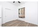 Clean bedroom with modern sliding door closet, contemporary window, and light wood flooring at 4220 N 32Nd St # 31, Phoenix, AZ 85018