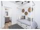 Inviting bedroom with a cozy platform bed, decorative wall baskets, and a view of en-suite bath at 4220 N 32Nd St # 31, Phoenix, AZ 85018