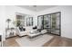 Modern living room with sleek furniture, stylish decor, natural light, and seamless access to outdoor views at 4220 N 32Nd St # 31, Phoenix, AZ 85018