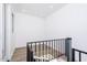 A bright, white staircase landing with a modern black railing, showcasing clean lines and recessed lighting at 4220 N 32Nd St # 31, Phoenix, AZ 85018