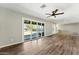 Bright living room with sliding glass doors to the backyard, vinyl floors and neutral paint at 428 E Kachina Trl, Phoenix, AZ 85042