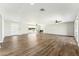 Expansive living room with beautiful vinyl floors, modern ceiling fans and abundant natural light at 428 E Kachina Trl, Phoenix, AZ 85042