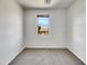 Vacant bedroom with a neutral color scheme and natural light at 43530 W Eddie Way, Maricopa, AZ 85138