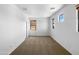A spacious bedroom with neutral carpeting, a sliding door closet and natural light at 43530 W Eddie Way, Maricopa, AZ 85138