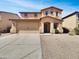 Charming two-story home with a two-car garage and well-maintained desert landscaping at 43530 W Eddie Way, Maricopa, AZ 85138