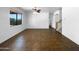 A spacious living room boasting tile flooring and staircase to the second floor at 43530 W Eddie Way, Maricopa, AZ 85138