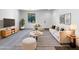 Stylish living room showcasing modern furniture, neutral tones, and bright natural light at 43530 W Eddie Way, Maricopa, AZ 85138