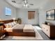 Comfortable main bedroom showcasing neutral tones, modern furniture, and a ceiling fan at 43530 W Eddie Way, Maricopa, AZ 85138