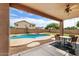 Inviting backyard oasis with a sparkling pool, covered patio, and comfortable seating area at 462 W Myrtle Dr, Chandler, AZ 85248