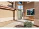 Welcoming front entrance with a cozy bench, covered porch, decorative windows, and attractive landscaping at 462 W Myrtle Dr, Chandler, AZ 85248